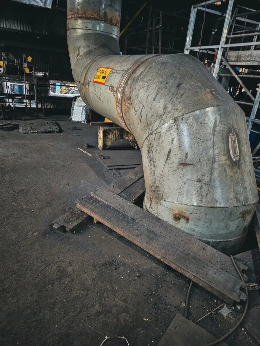 Fabricated duct run seen end-on, showing the mitred bends and flange faces
