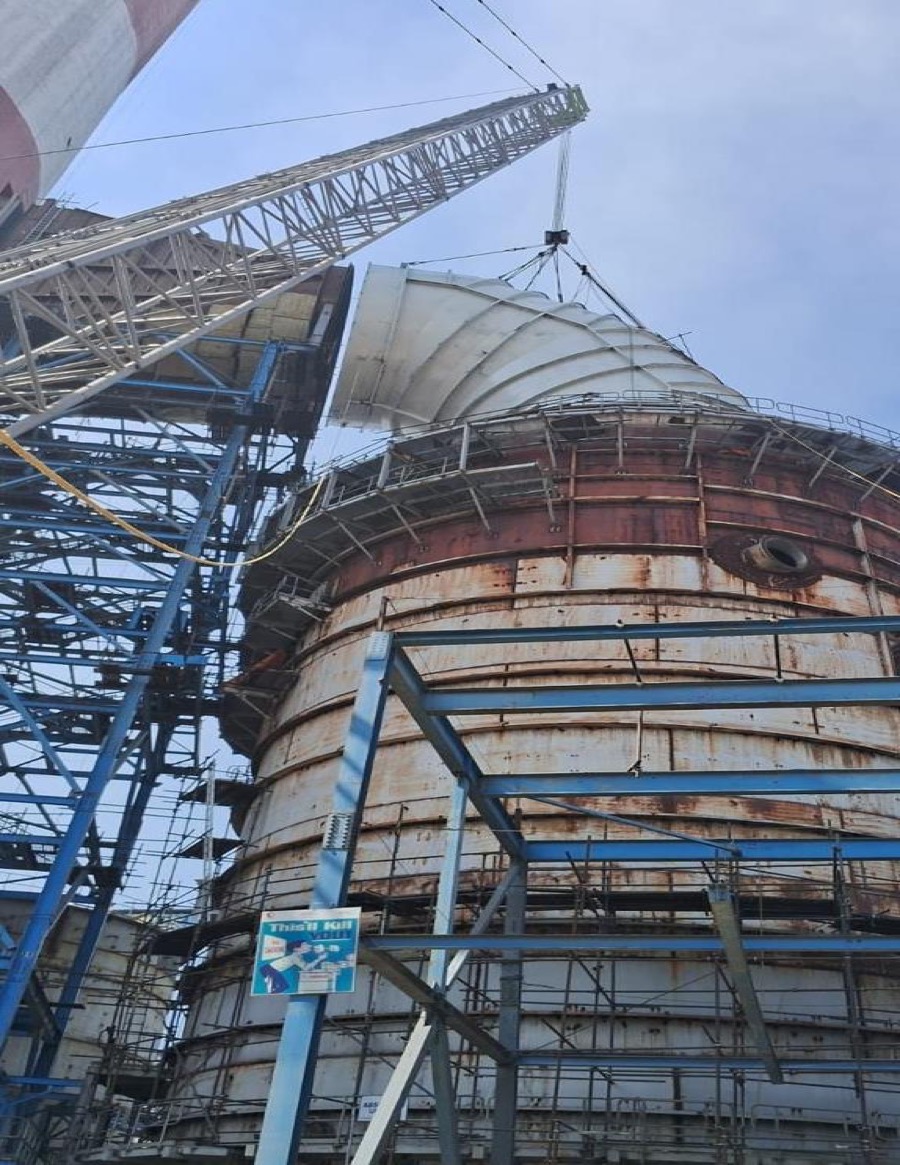 Absorber shell section being lifted into position by crawler crane